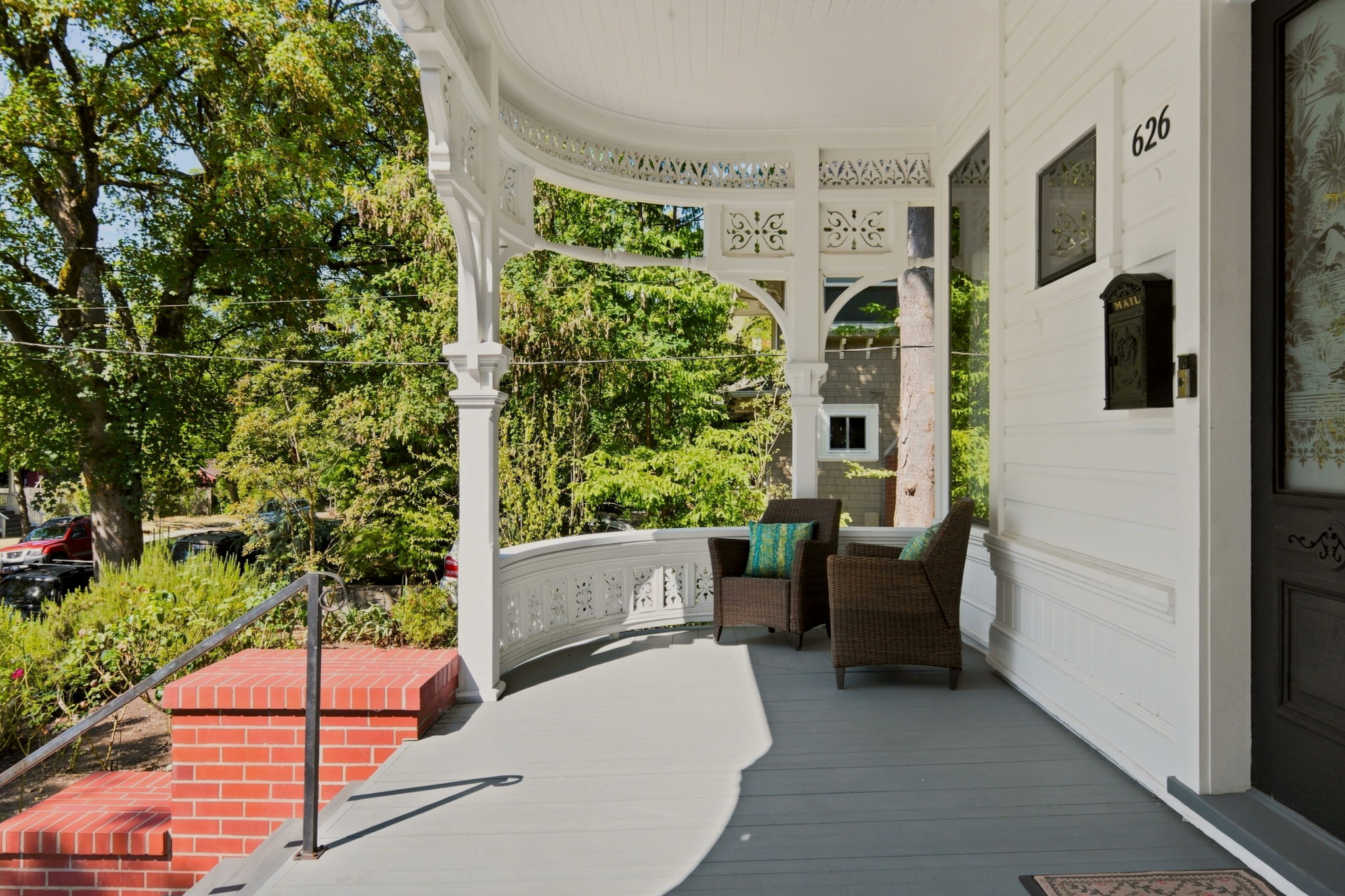 Wraparound veranda and ornate entry of the Fenton House