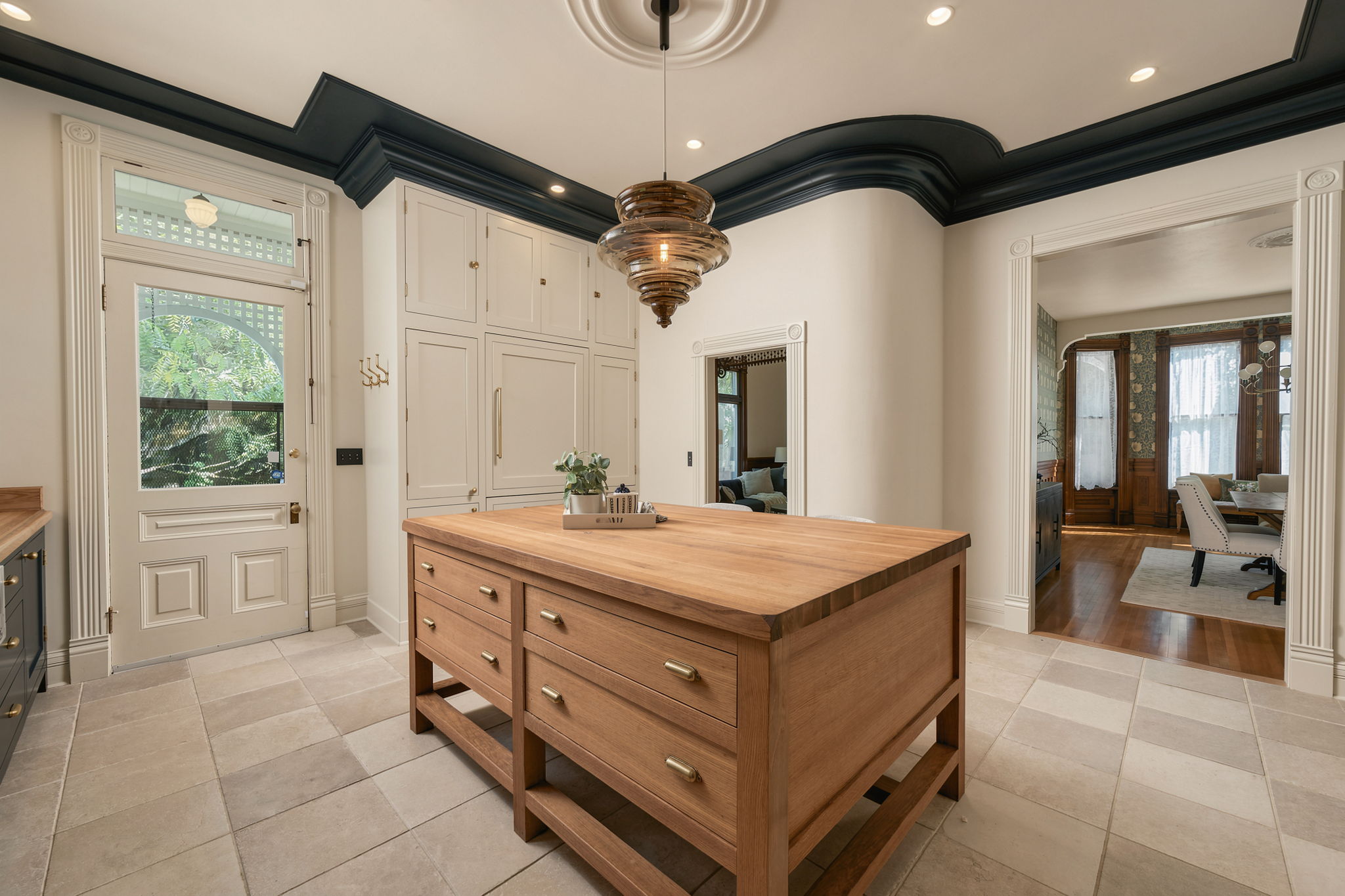 Updated kitchen with wood island and blue accents