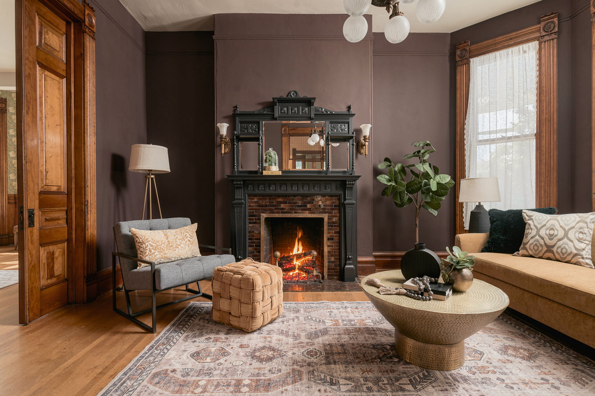 Formal living room with fireplace and tall windows